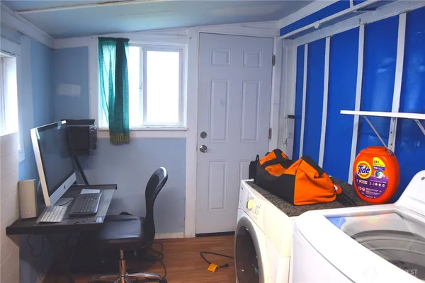 a workspace with furniture and window