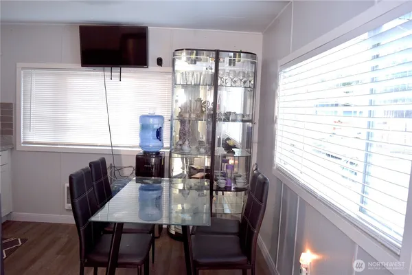a view of a dining room with furniture and window