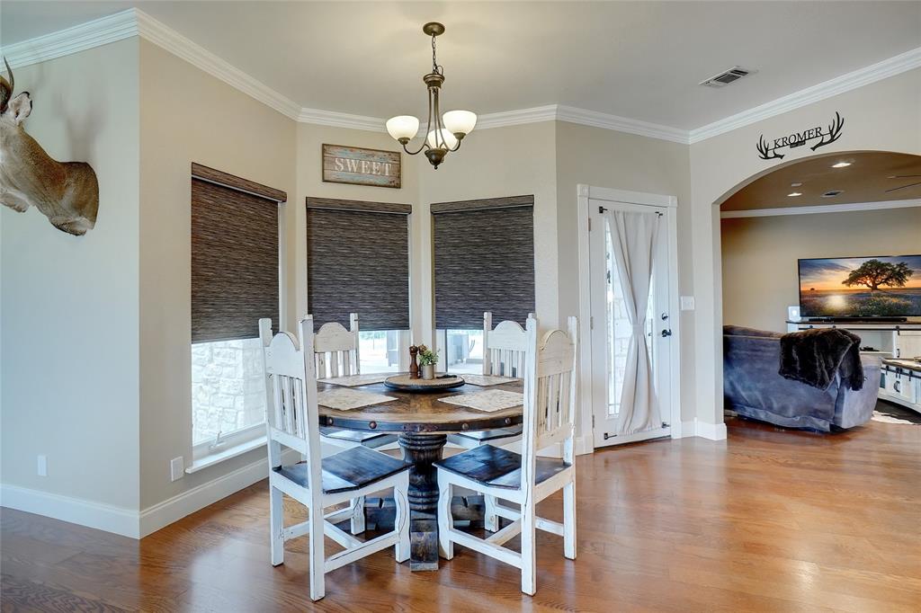 13340 John Day Road Haslet, TX 76052 - Photo 10 of 30 a dining room with furniture and wooden floor