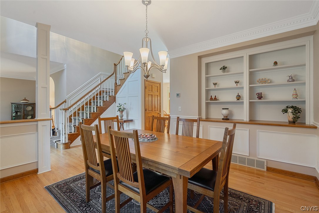 3104 Corlear Drive Lysander, NY 13027 - Photo 5 of 29 Dining room with built in shelves and crown moldin