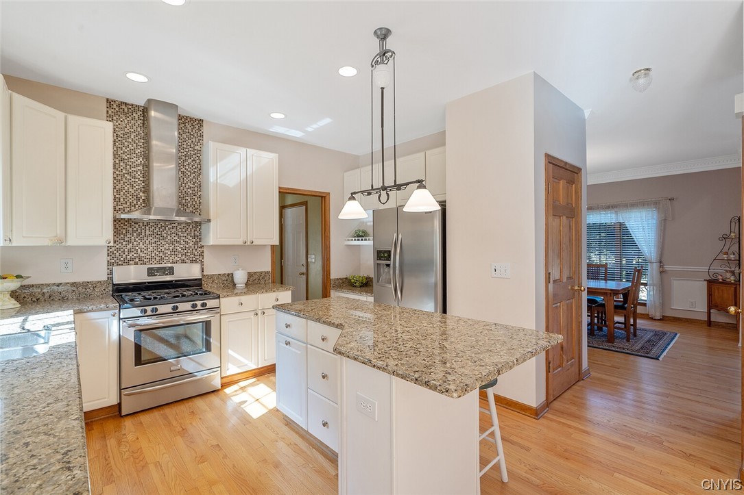 3104 Corlear Drive Lysander, NY 13027 - Photo 8 of 29 kitchen with gas range with hood exhaust fan