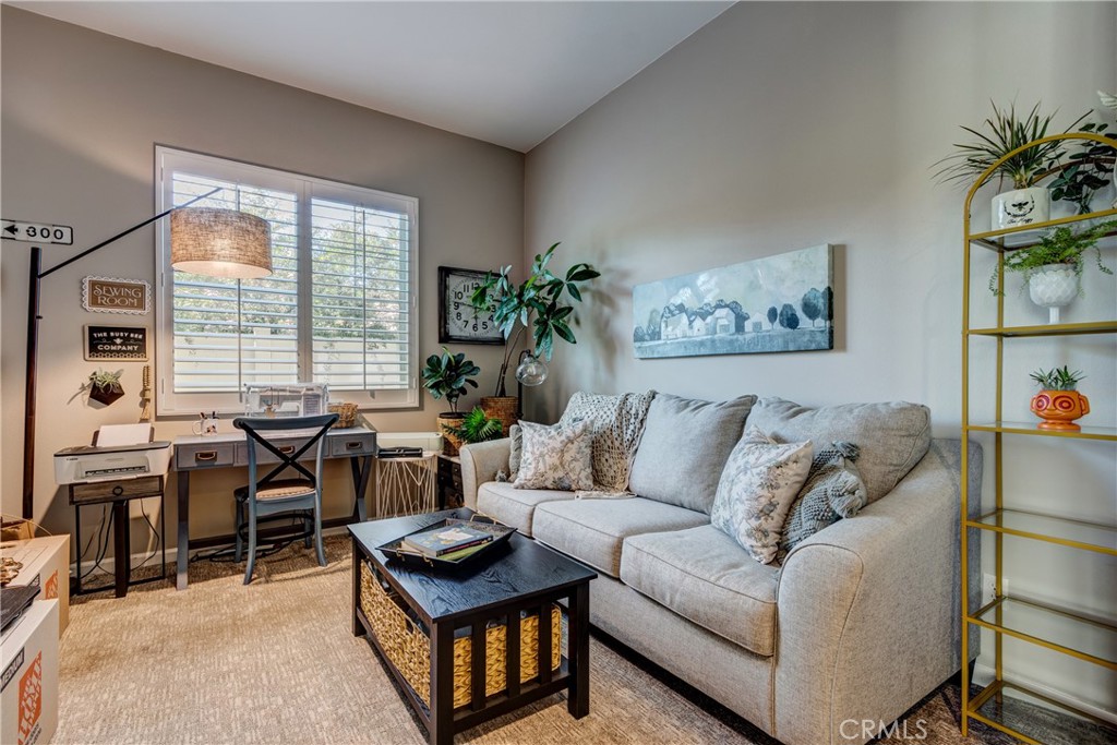 11137 Briar Rose Court Corona, CA 92883 - Photo 38 of 75 a living room with furniture and a large window