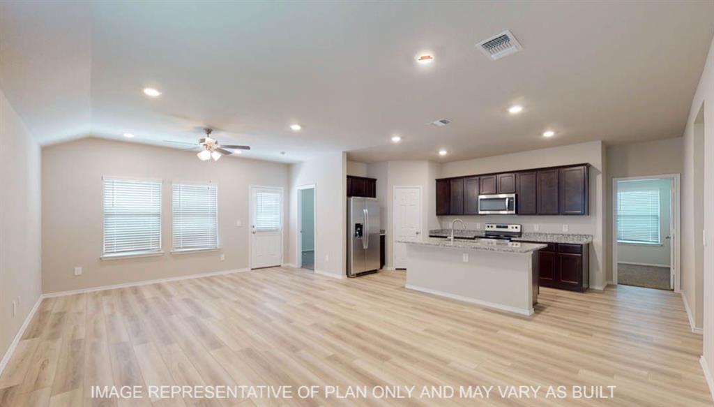 3112 Cyprian Road Lorena, TX 76655 - Photo 6 of 20 Spacious open-concept living area featuring wood-finish flooring, vaulted ceilings, and recessed lighting