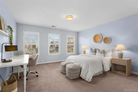 a bedroom with bed and a window