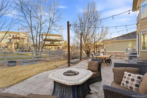 a view of a patio with couches and pool