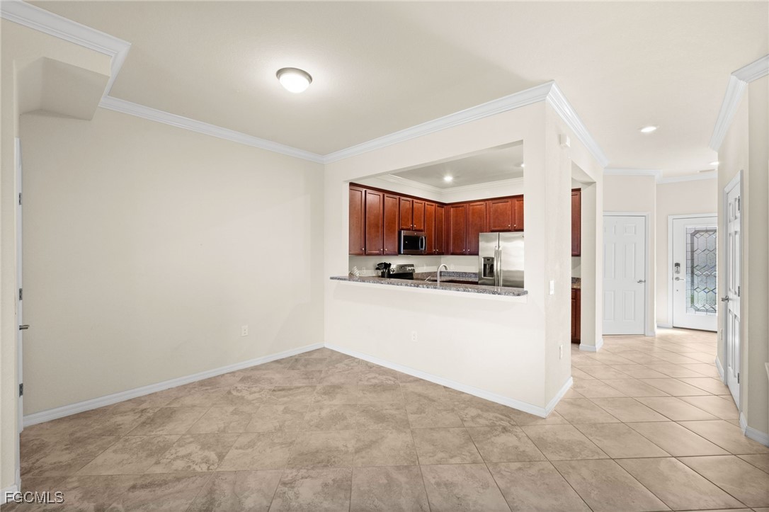 10173 Via Colomba Circle Fort Myers, FL 33966 - Photo 15 of 50 a view of a kitchen and refrigerator