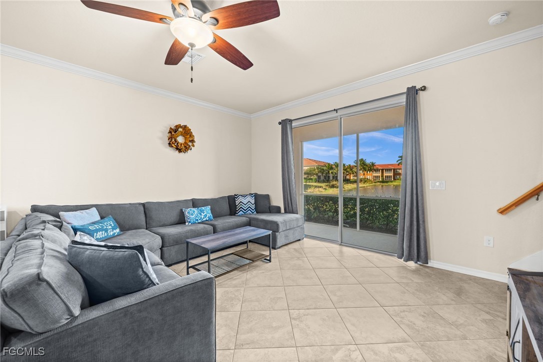 10173 Via Colomba Circle Fort Myers, FL 33966 - Photo 19 of 50 a living room with furniture and a floor to ceiling window
