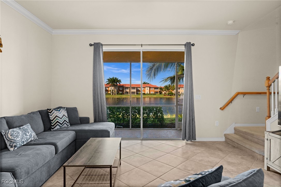10173 Via Colomba Circle Fort Myers, FL 33966 - Photo 20 of 50 a living room with furniture and a floor to ceiling window
