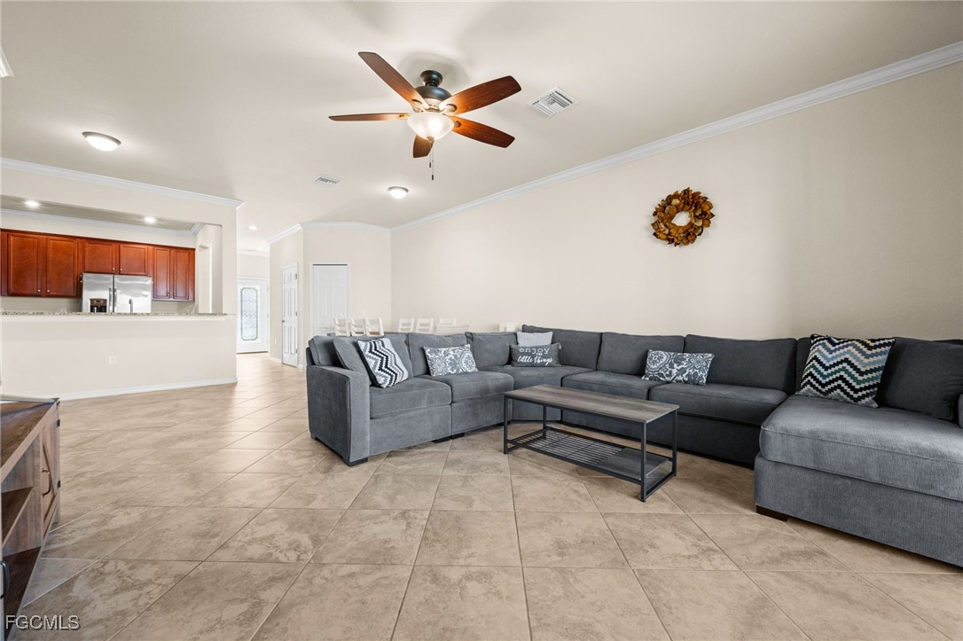 10173 Via Colomba Circle Fort Myers, FL 33966 - Photo 21 of 50 a living room with furniture and a ceiling fan