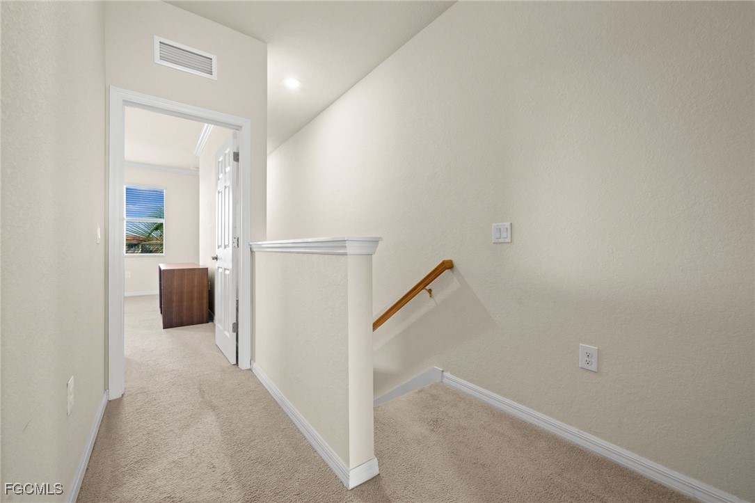10173 Via Colomba Circle Fort Myers, FL 33966 - Photo 22 of 50 a view of a hallway with closet and a couch