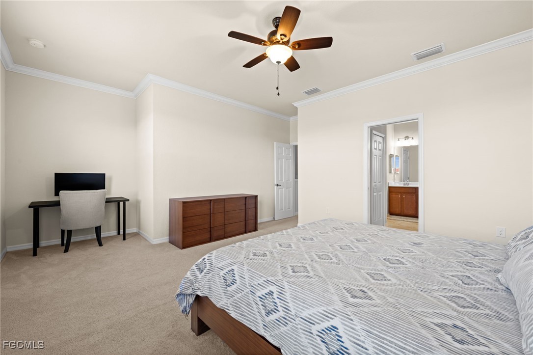 10173 Via Colomba Circle Fort Myers, FL 33966 - Photo 24 of 50 a bedroom with a bed and a chair