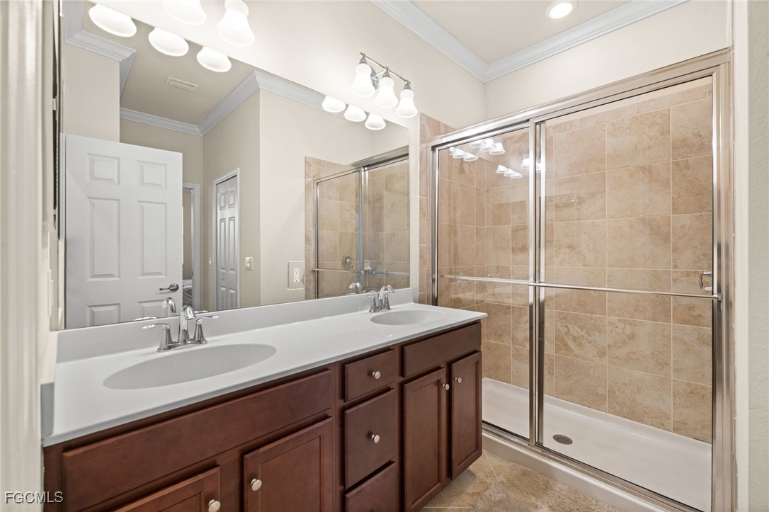 10173 Via Colomba Circle Fort Myers, FL 33966 - Photo 27 of 50 a bathroom with a sink double vanity and a shower