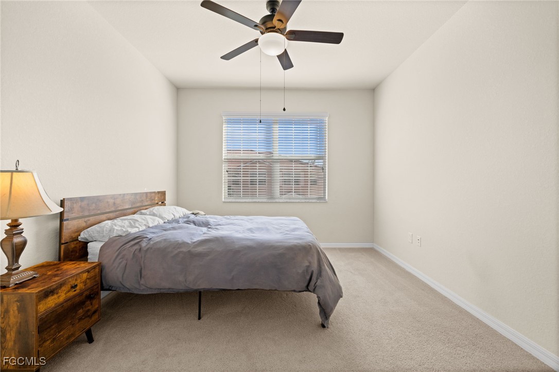 10173 Via Colomba Circle Fort Myers, FL 33966 - Photo 31 of 50 a bed sitting in a bedroom next to a window