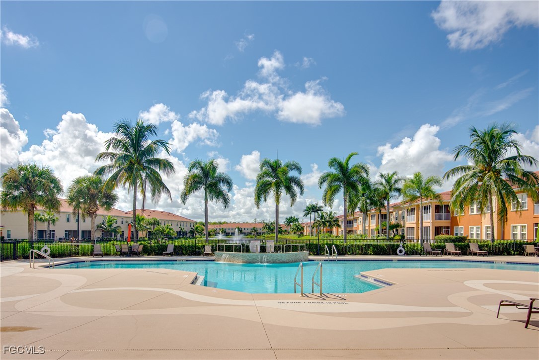 10173 Via Colomba Circle Fort Myers, FL 33966 - Photo 41 of 50 a view of a houses with a yard and a palm tree