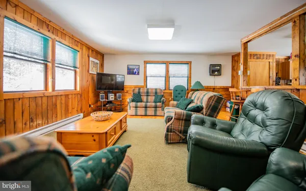 a balcony with furniture and a large window