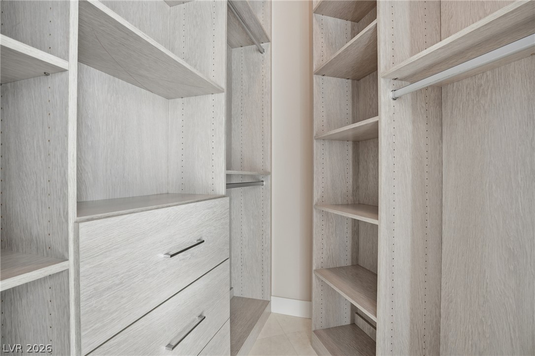 360 East Desert Inn Road, Unit 1701 Las Vegas, NV 89109 - Photo 24 of 33 Organized living with extensive built-in shelving and ample storage options.