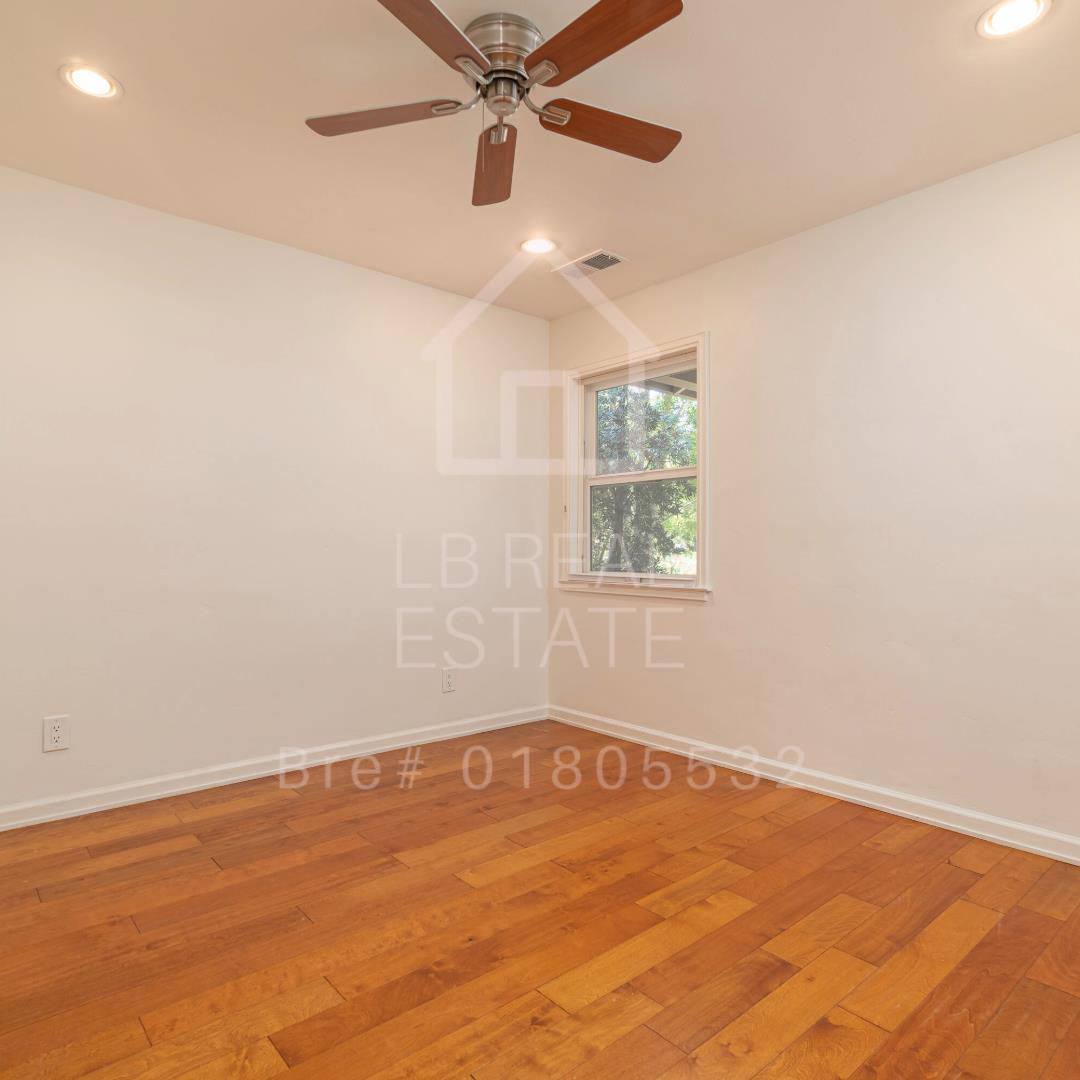 1382 Sir Francis Drake Boulevard San Anselmo, CA 94960 - Photo 11 of 16 an empty room with a window and ceiling fan