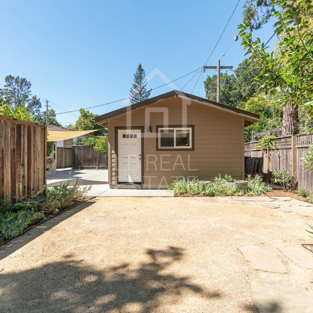 1382 Sir Francis Drake Boulevard San Anselmo, CA 94960 - Photo 13 of 16 a front view of a house with a yard and potted plants