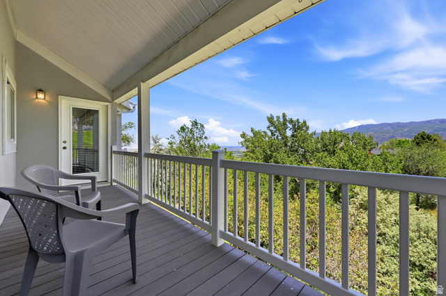 3766 Cardiff Circle Bountiful, UT 84010 - Photo 18 of 46 Covered balcony featuring a vaulted ceiling and composite decking