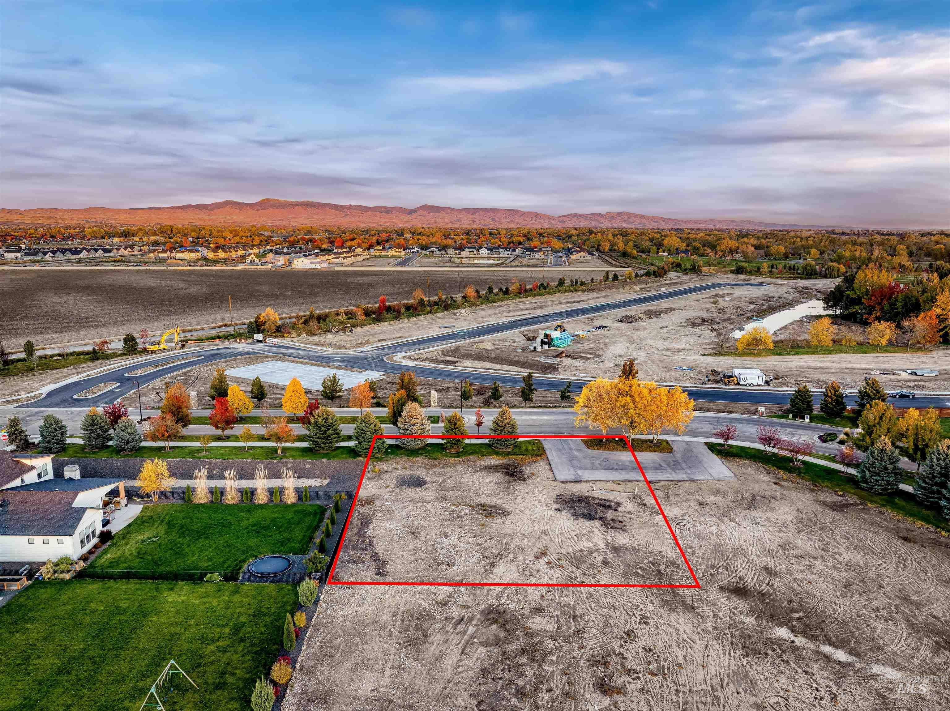 21583 River Ranch Lane Star, ID 83669 - Photo 11 of 26 Aerial view of property and surrounding area with property boundaries highlighted and a mountainous background