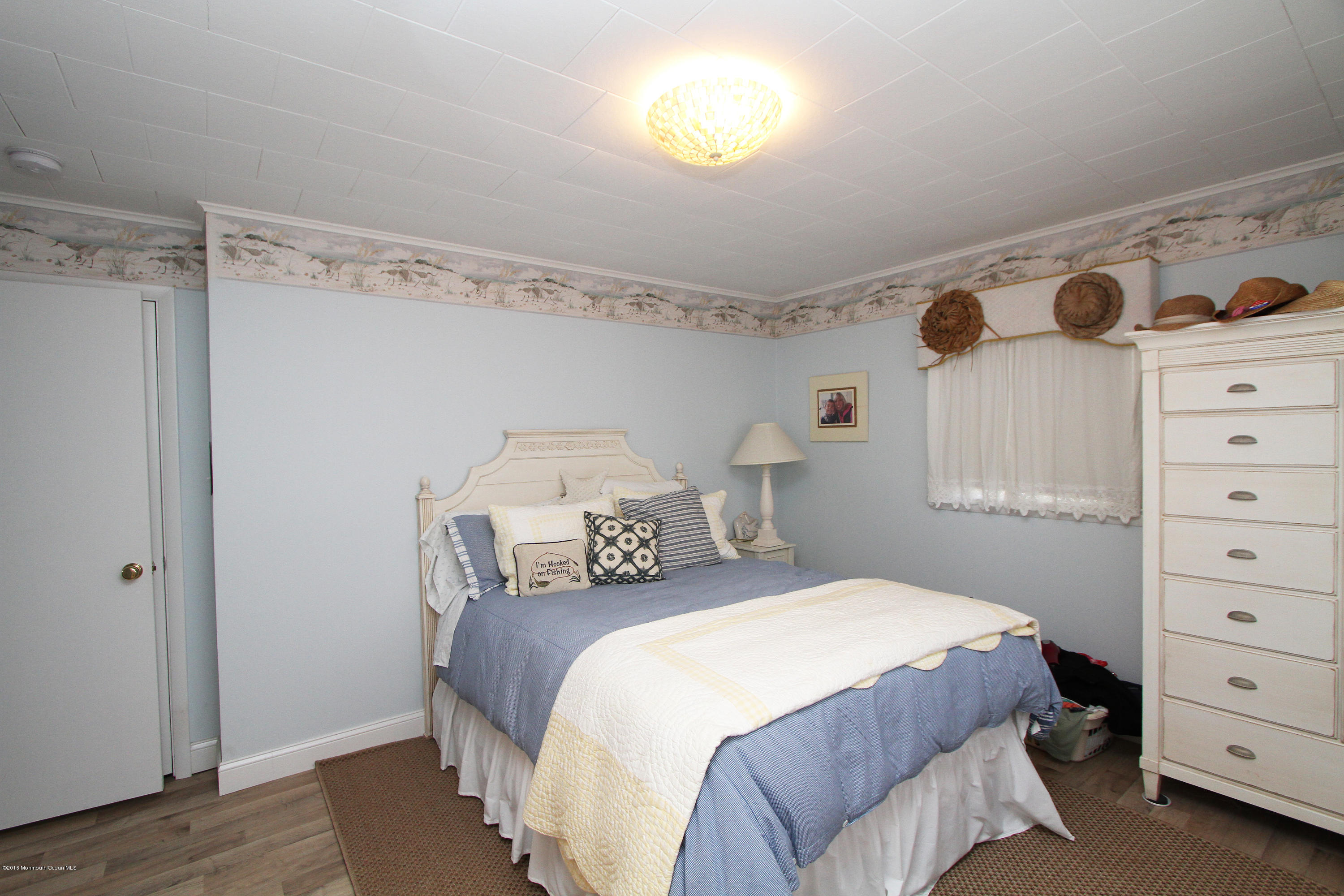 37 Silver Beach Road Lavallette, NJ 08735 - Photo 11 of 33 a bedroom with a bed and a window