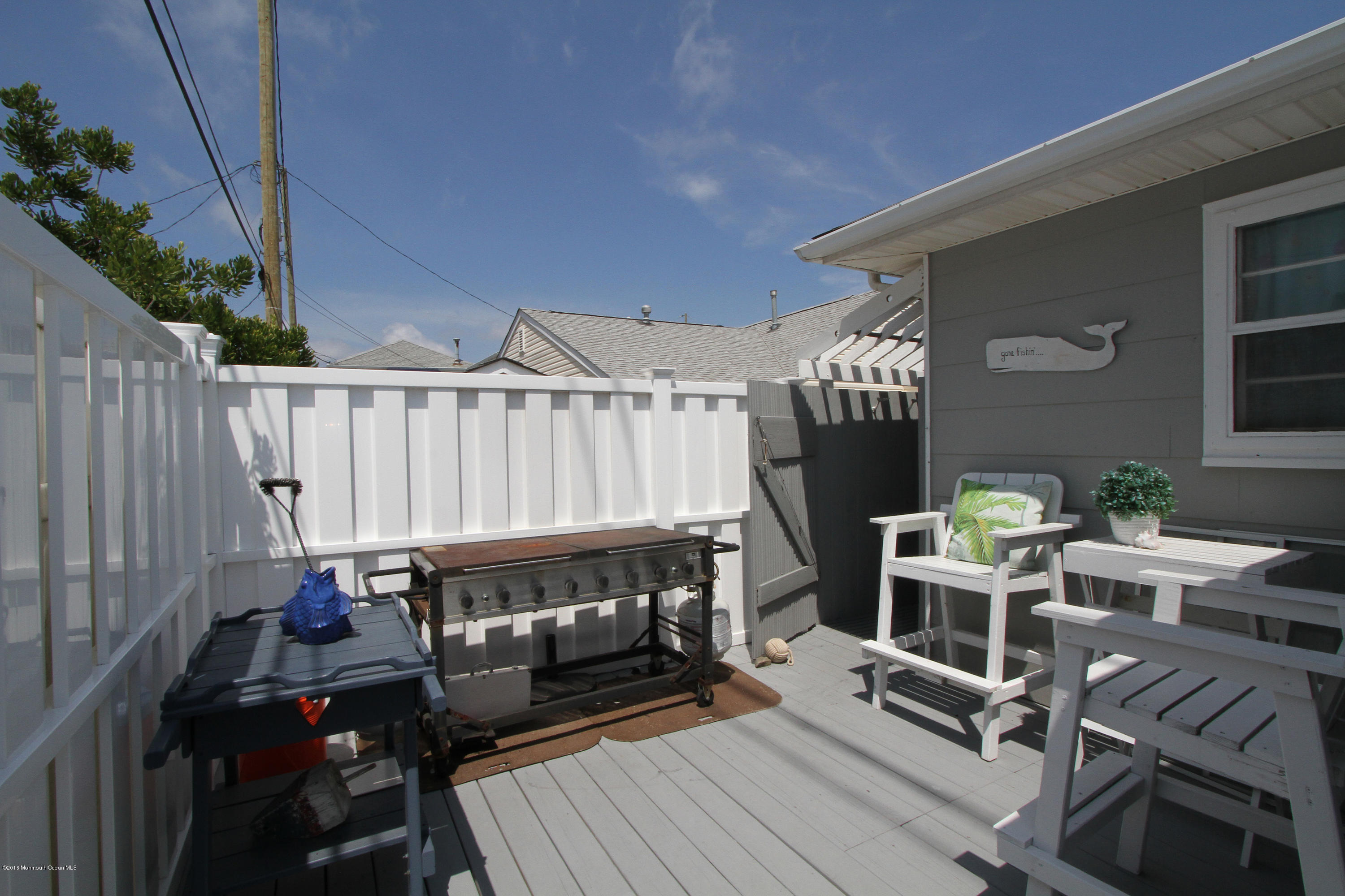 37 Silver Beach Road Lavallette, NJ 08735 - Photo 20 of 33 a balcony with furniture and wooden floor