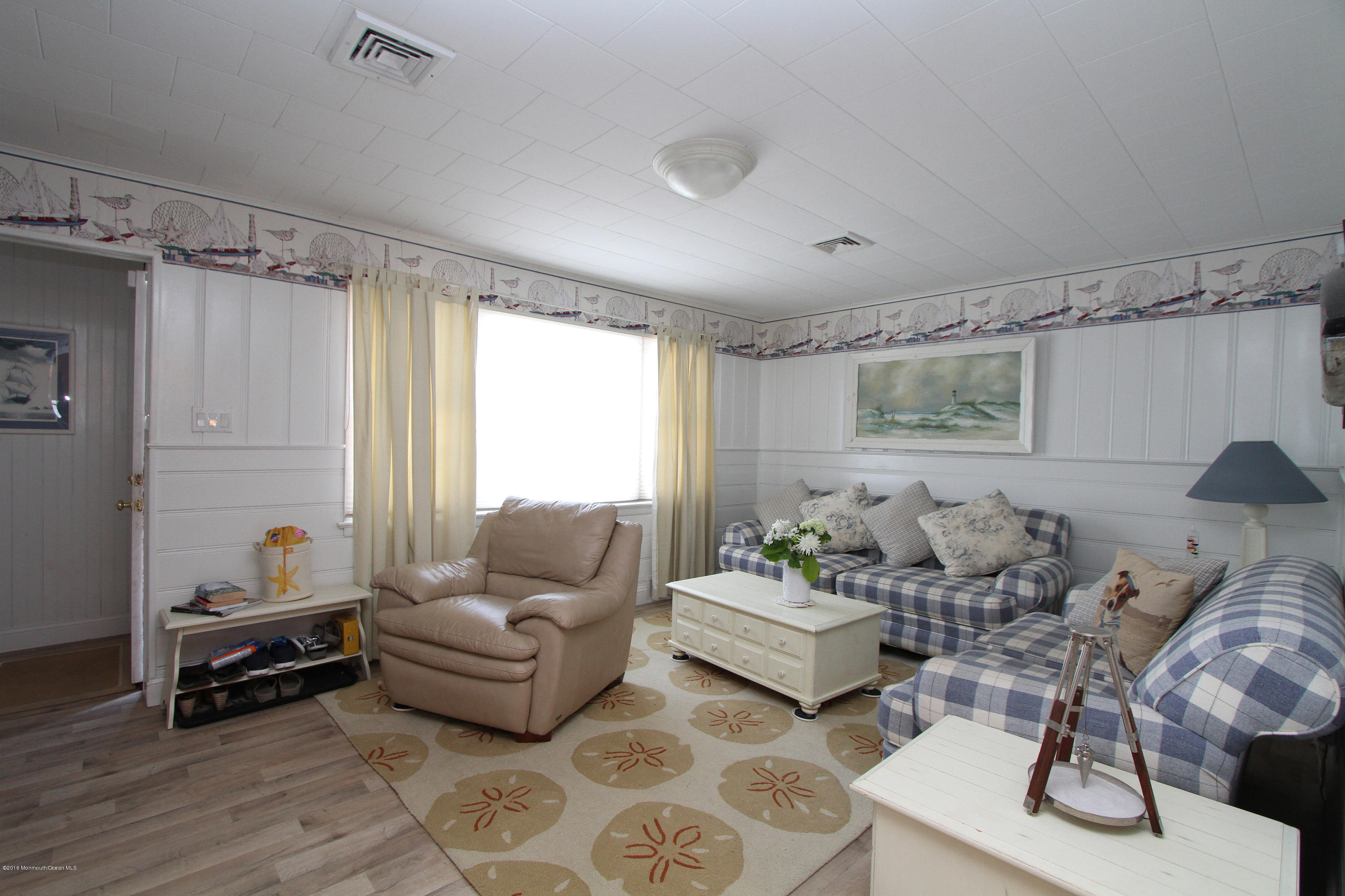 37 Silver Beach Road Lavallette, NJ 08735 - Photo 6 of 33 a living room with furniture and a large window
