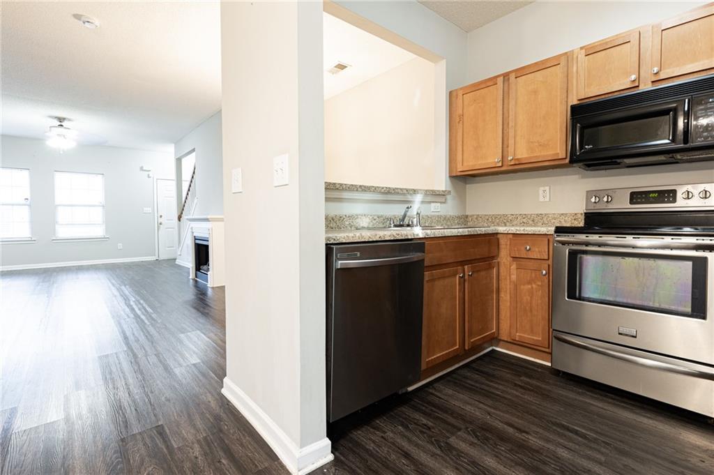 3622 Ginnis Road, Unit 5 Atlanta, GA 30331 - Photo 12 of 29 a kitchen with a sink stove and microwave