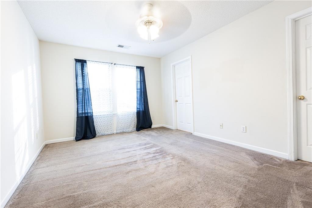 3622 Ginnis Road, Unit 5 Atlanta, GA 30331 - Photo 15 of 29 an empty room with windows and closet