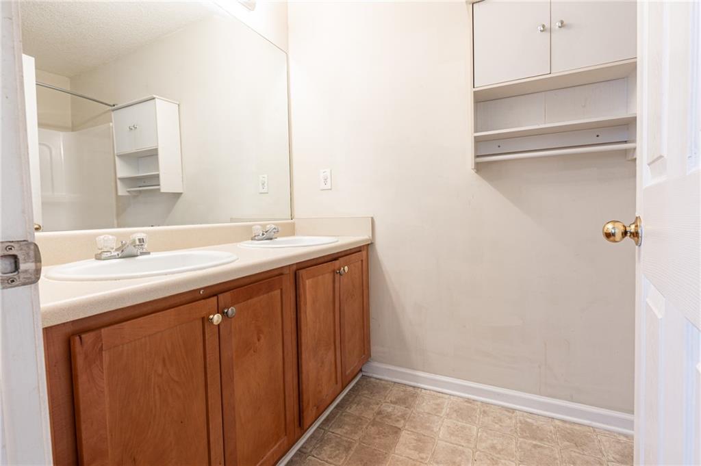 3622 Ginnis Road, Unit 5 Atlanta, GA 30331 - Photo 18 of 29 a bathroom with a sink and a mirror