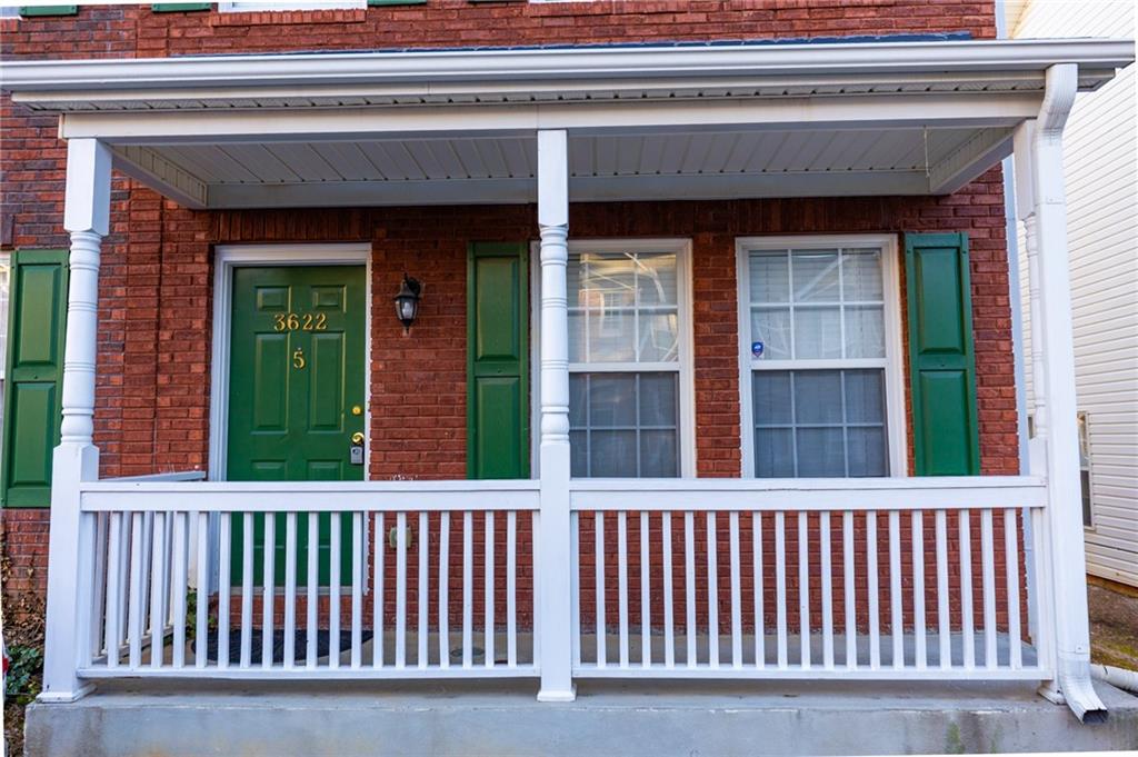 3622 Ginnis Road, Unit 5 Atlanta, GA 30331 - Photo 2 of 29 a porch with a small yard