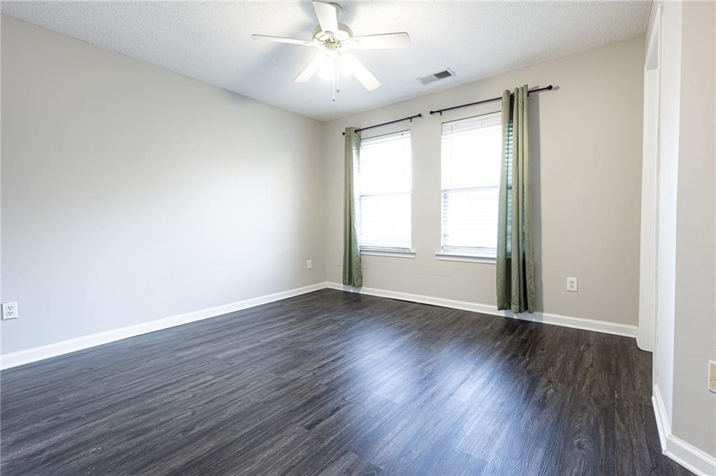 3622 Ginnis Road, Unit 5 Atlanta, GA 30331 - Photo 23 of 29 a view of an empty room with wooden floor and a window
