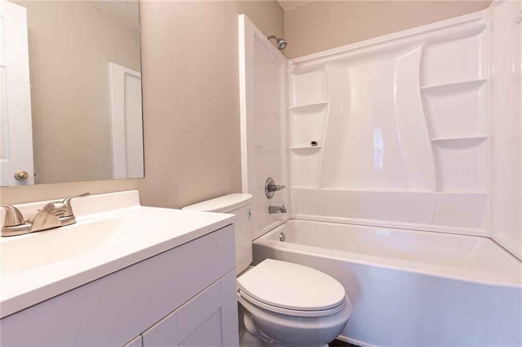 3622 Ginnis Road, Unit 5 Atlanta, GA 30331 - Photo 26 of 29 a bathroom with a sink a toilet and a bathtub