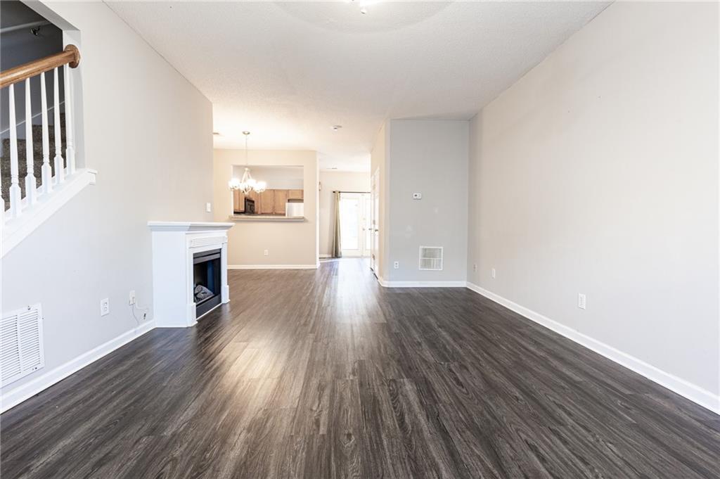 3622 Ginnis Road, Unit 5 Atlanta, GA 30331 - Photo 5 of 29 wooden floor in an empty room with a fireplace