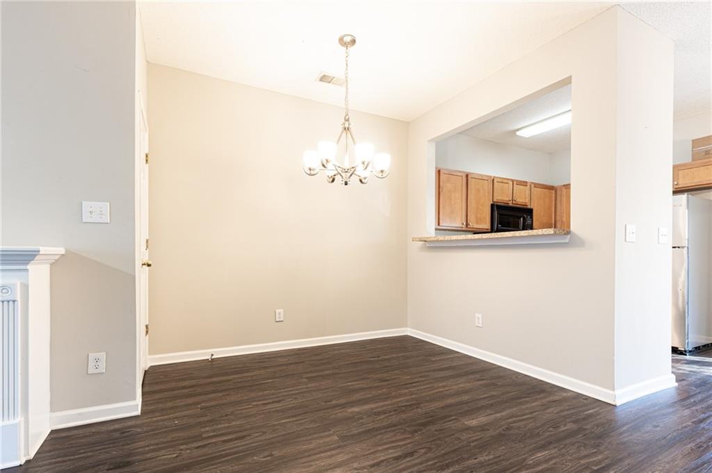 3622 Ginnis Road, Unit 5 Atlanta, GA 30331 - Photo 7 of 29 a view of a room with wooden floor and window