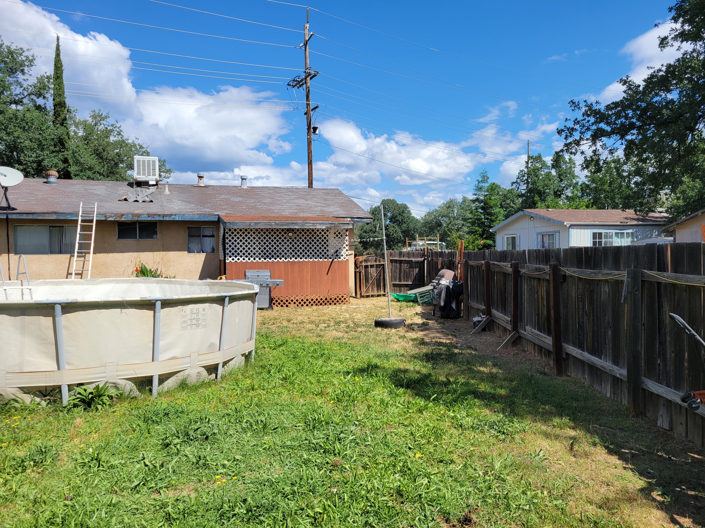 3551 Oasis Road Redding, CA 96003 - Photo 23 of 27 3551 Oasis back left side of house - Cop