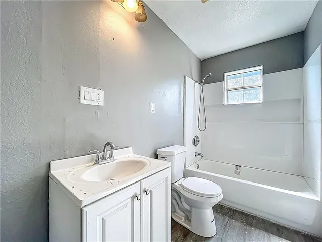 a bathroom with a sink toilet and a bathtub