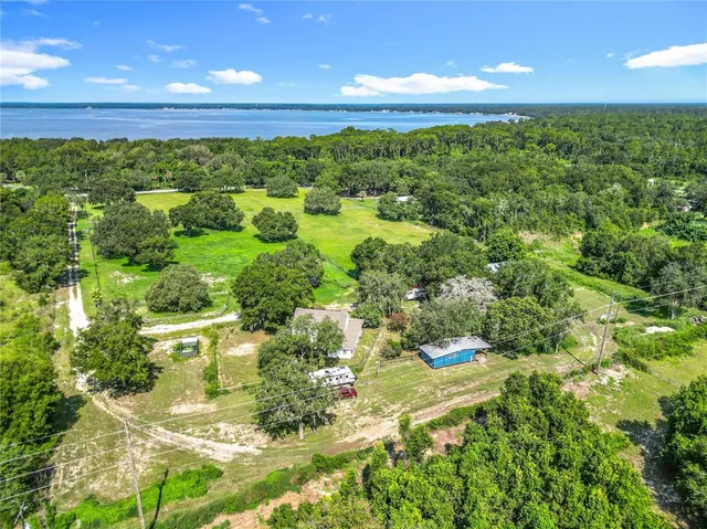 a view of a yard with swimming pool