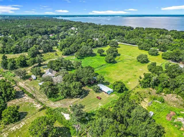 a view of a lake with a yard