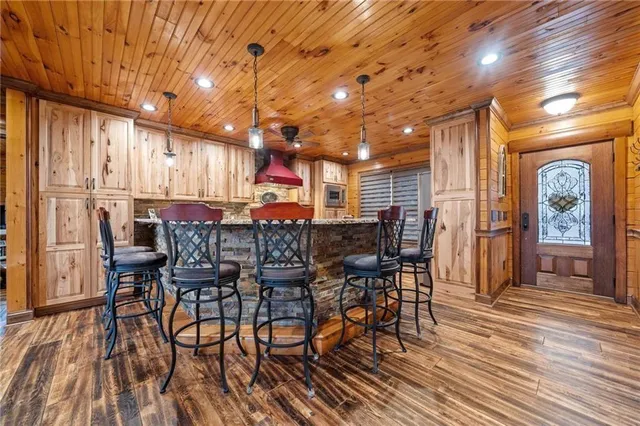 a kitchen with stainless steel appliances granite countertop a sink and cabinets