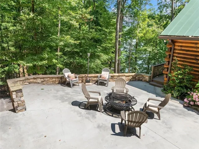 a view of a wooden deck with a lake view