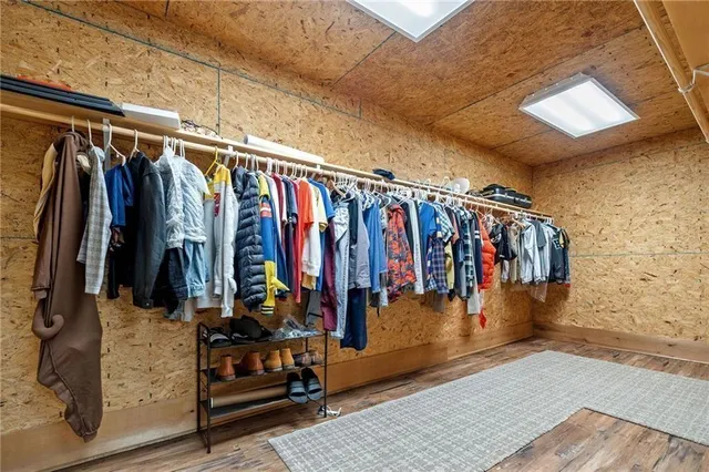 an aerial view of a house with a yard and lake view