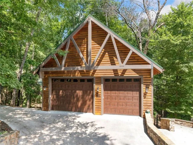 a kitchen with stainless steel appliances granite countertop a stove a sink dishwasher and cabinets with wooden floor