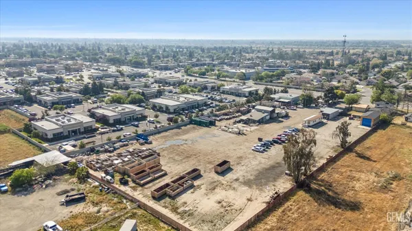 a view of a terrace with furniture and city view