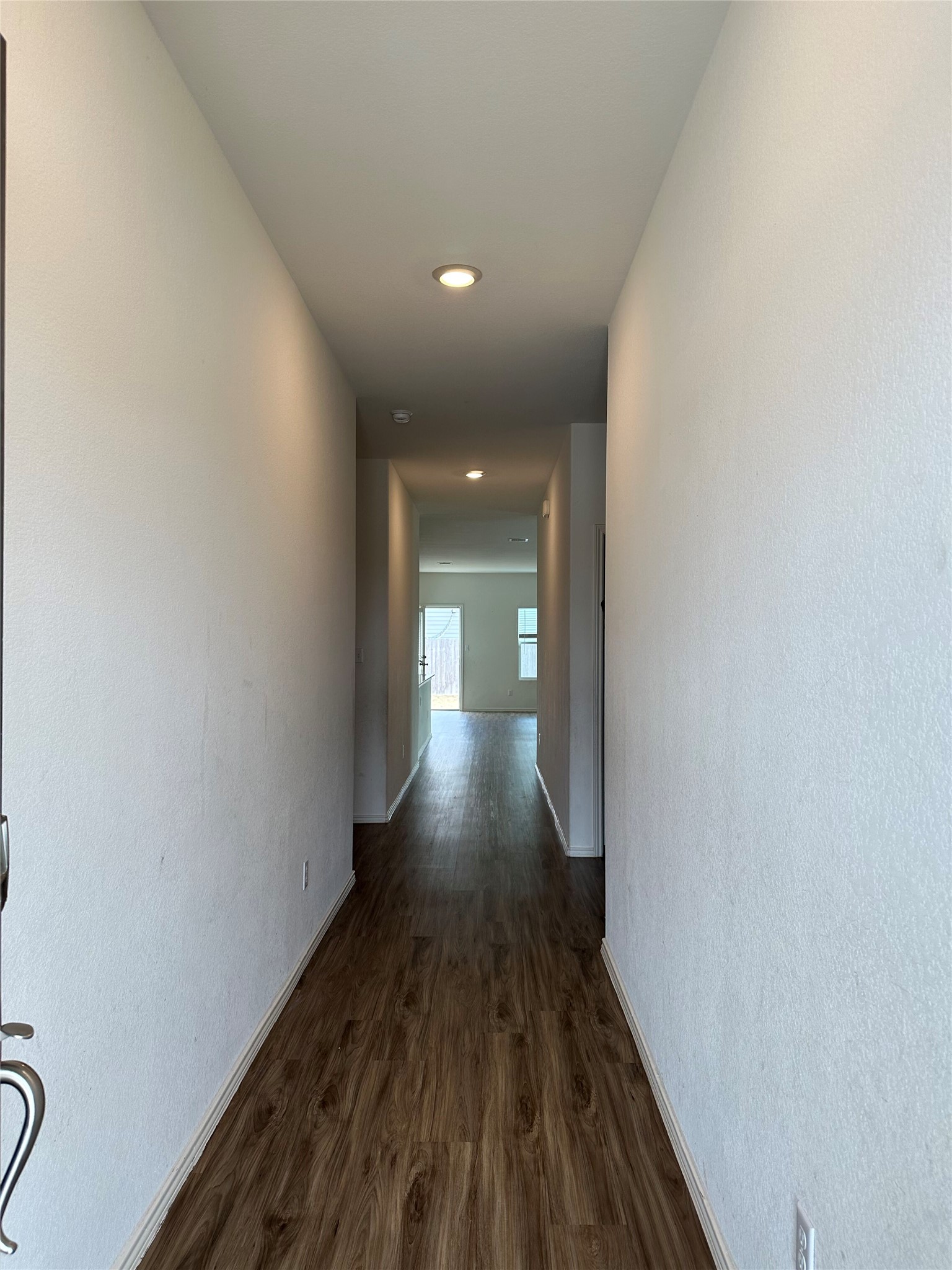13501 Mussel Run Elgin, TX 78621 - Photo 14 of 28 Inviting entryway featuring wood-finish flooring, recessed lighting, and a neutral color palette