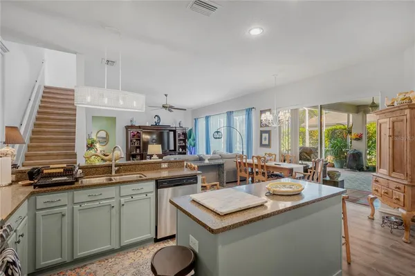a kitchen with a sink stove and cabinets
