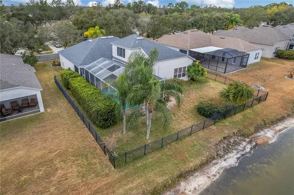 an aerial view of house with yard