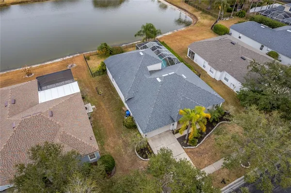 an aerial view of a house with a swimming pool