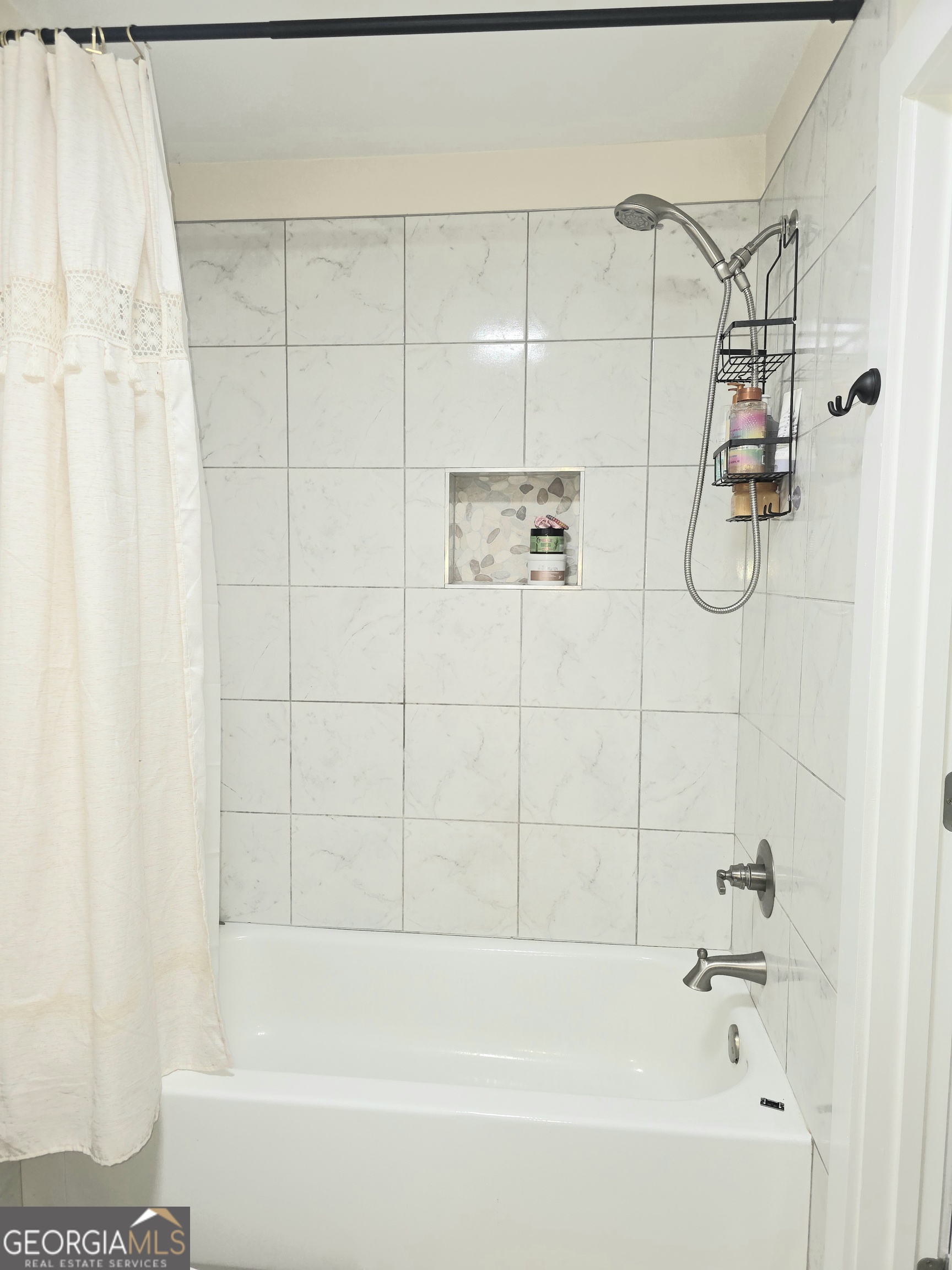 3060 Eatonton Road Madison, GA 30650 - Photo 49 of 65 a bathroom with a shower and a bath tub
