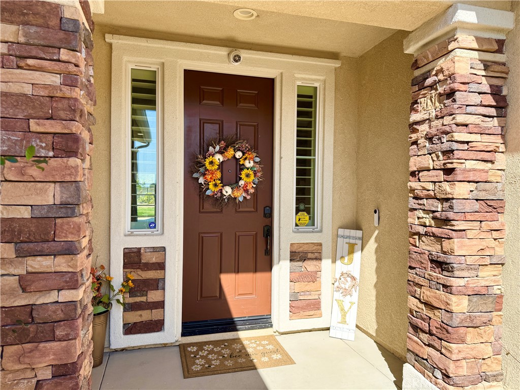 17841 Grapevine Lane San Bernardino, CA 92407 - Photo 11 of 63 front view of a building with a door and a window